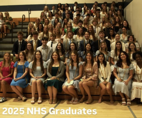 Seniors graduating from the National Honors Society sit down for a class picture. Senior parents gather to take various photos of their children with a sense of pride. Anna Wasiak, National Honors Society graduate said, “it was all such a bittersweet moment.”